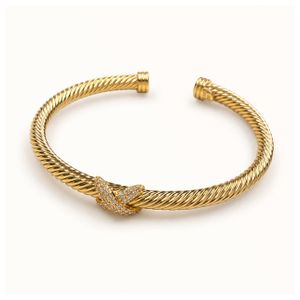 Gold Criss Cross Bangle Product Image